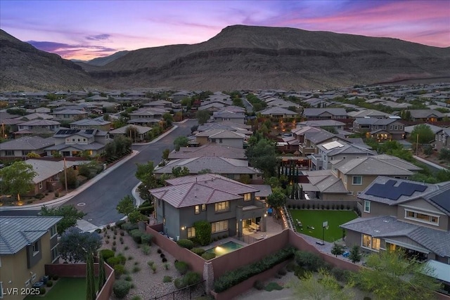 10470 Dove Meadow Way, Las Vegas, NV 89135 - aerial view at dusk of a residential view and a mountain view