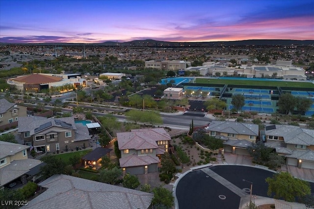 10470 Dove Meadow Way, Las Vegas, NV 89135 - aerial view at dusk of a residential view and a mountain view