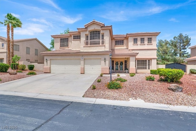 7310 Heggie Ave, Las Vegas, NV 89131 - mediterranean / spanish-style home with stucco siding, a tiled roof, driveway, french doors, and a garage