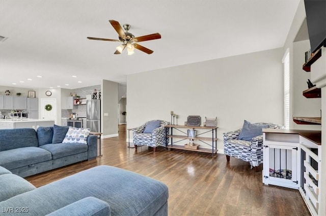 7310 Heggie Ave, Las Vegas, NV 89131 - living area featuring a ceiling fan, wood finished floors, baseboards, and recessed lighting