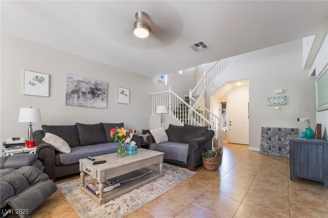 9513 Perennial View Ave, Las Vegas, NV 89148 - living room with a ceiling fan, light tile patterned floors, and stairway