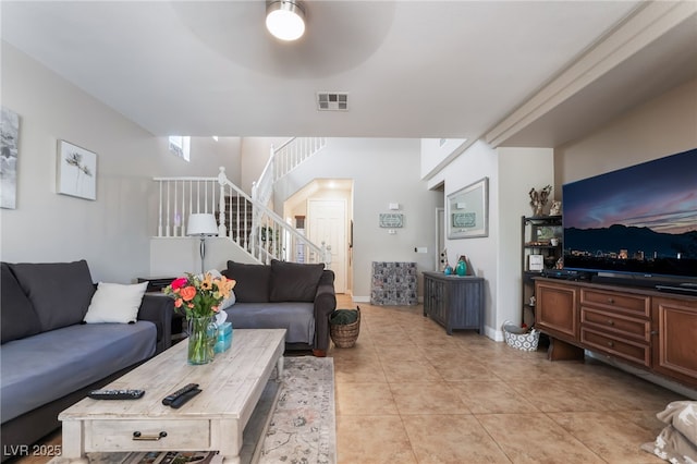 9513 Perennial View Ave, Las Vegas, NV 89148 - living area featuring a ceiling fan, stairway, and light tile patterned floors