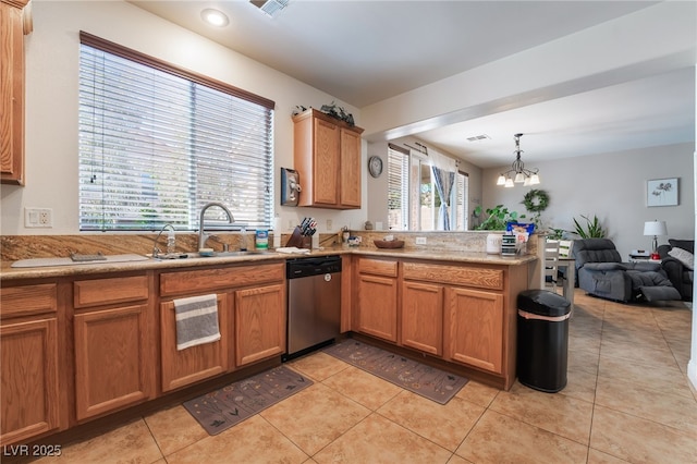 9513 Perennial View Ave, Las Vegas, NV 89148 - kitchen with stainless steel dishwasher, a sink, a peninsula, light tile patterned floors, and open floor plan
