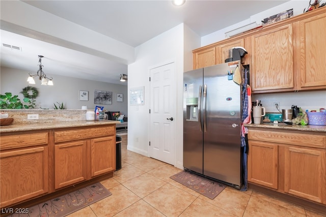 9513 Perennial View Ave, Las Vegas, NV 89148 - kitchen with stainless steel fridge, light tile patterned flooring, and pendant lighting