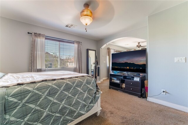 9513 Perennial View Ave, Las Vegas, NV 89148 - bedroom with arched walkways, light colored carpet, baseboards, and a ceiling fan