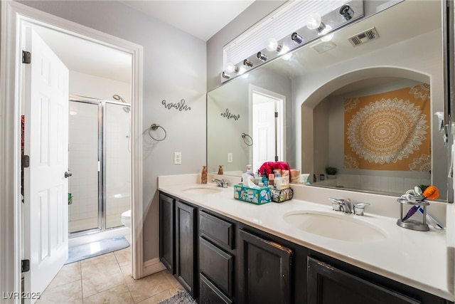 9513 Perennial View Ave, Las Vegas, NV 89148 - full bathroom featuring a shower stall, double vanity, and toilet