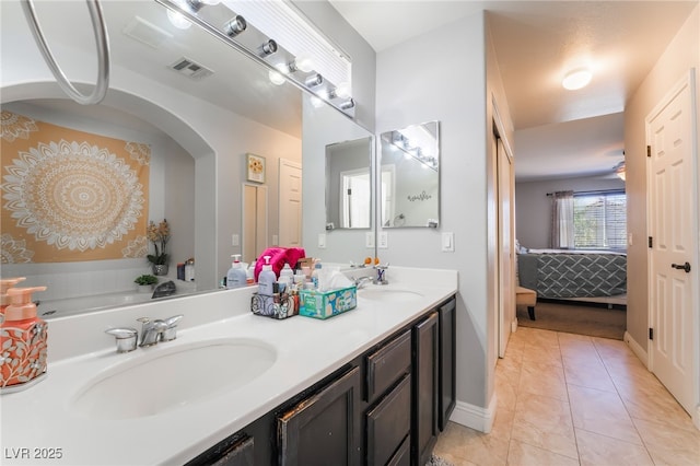 9513 Perennial View Ave, Las Vegas, NV 89148 - bathroom featuring double vanity, connected bathroom, and baseboards
