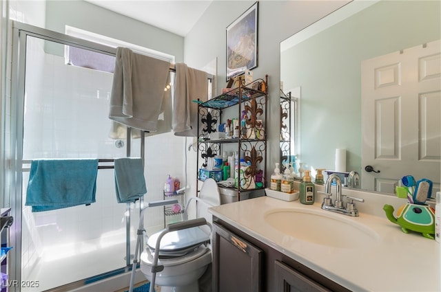 9513 Perennial View Ave, Las Vegas, NV 89148 - bathroom featuring a shower stall, vanity, and toilet