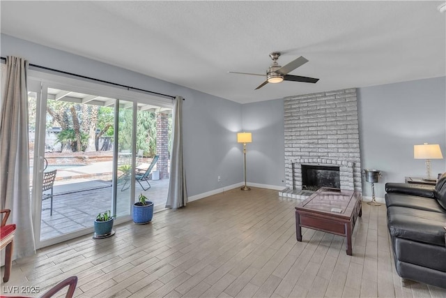1808 Piccolo Way, Las Vegas, NV 89146 - living room with ceiling fan, wood finished floors, baseboards, and a fireplace