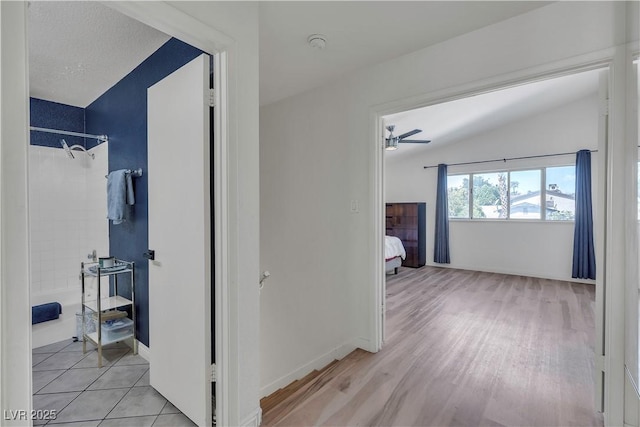 1808 Piccolo Way, Las Vegas, NV 89146 - hallway featuring light wood finished floors and lofted ceiling