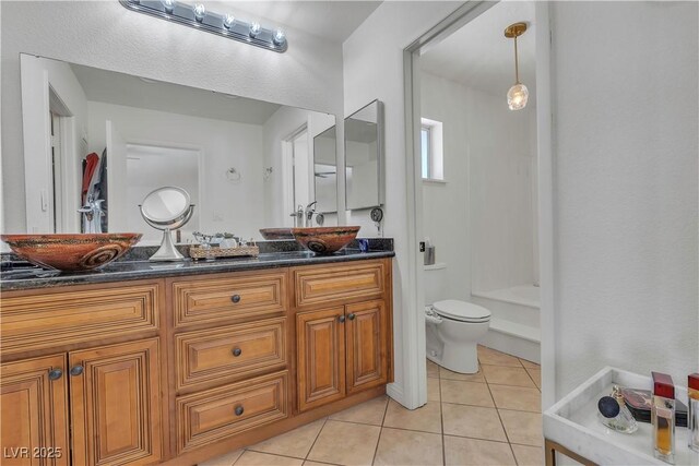 1808 Piccolo Way, Las Vegas, NV 89146 - full bathroom featuring tile patterned floors, toilet, double vanity, and a shower