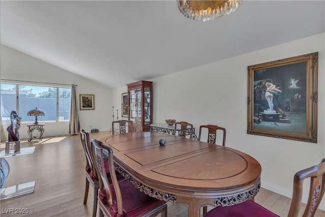 1808 Piccolo Way, Las Vegas, NV 89146 - dining space with vaulted ceiling, light wood-style flooring, and baseboards
