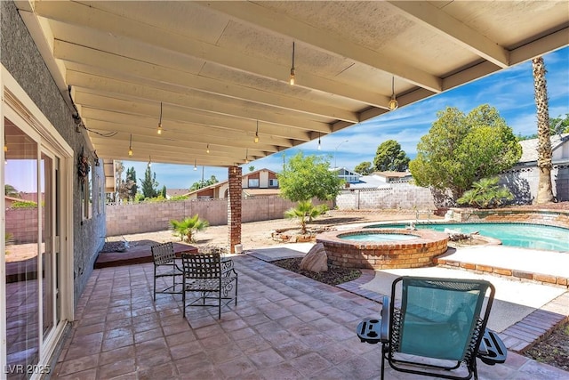 1808 Piccolo Way, Las Vegas, NV 89146 - fenced backyard featuring a patio area and an in-ground hot tub