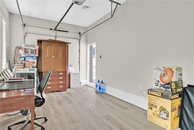 6184 Willow Rock St, Las Vegas, NV 89135 - office space featuring wood finished floors, a garage, and baseboards