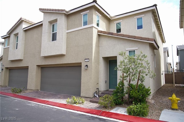 2761 Frosted Teal Ave, North Las Vegas, NV 89086 - multi unit property featuring stucco siding, a garage, and a tiled roof