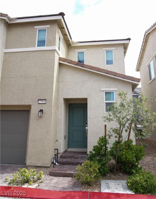 2761 Frosted Teal Ave, North Las Vegas, NV 89086 - entrance to property featuring stucco siding and a garage