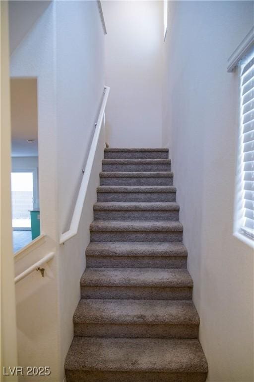 stairs featuring plenty of natural light