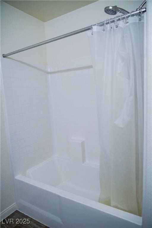 full bathroom with shower / tub combo with curtain