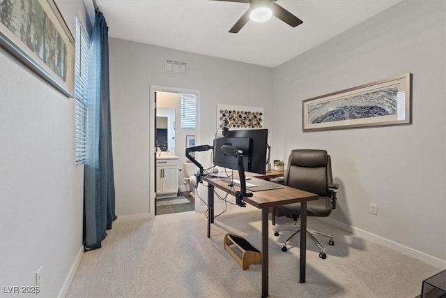 10954 Free Flow Pl, Las Vegas, NV 89138 - home office with a ceiling fan, light carpet, and baseboards