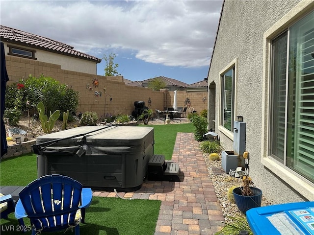 8269 Skye Peak St, Las Vegas, NV 89166 - view of patio / terrace with a hot tub and a fenced backyard