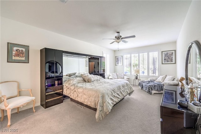 8269 Skye Peak St, Las Vegas, NV 89166 - bedroom featuring light colored carpet and ceiling fan