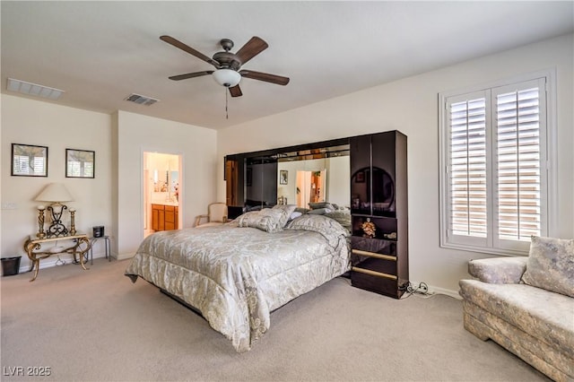 8269 Skye Peak St, Las Vegas, NV 89166 - carpeted bedroom featuring baseboards, a ceiling fan, and connected bathroom
