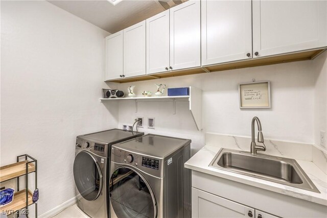 8269 Skye Peak St, Las Vegas, NV 89166 - laundry area with washing machine and clothes dryer and cabinet space