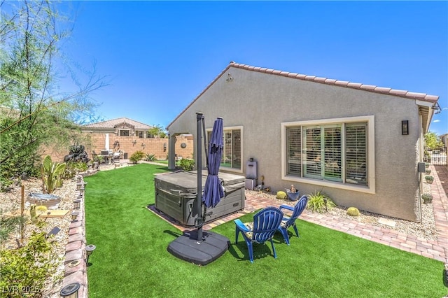 8269 Skye Peak St, Las Vegas, NV 89166 - rear view of house featuring a hot tub, stucco siding, and a patio
