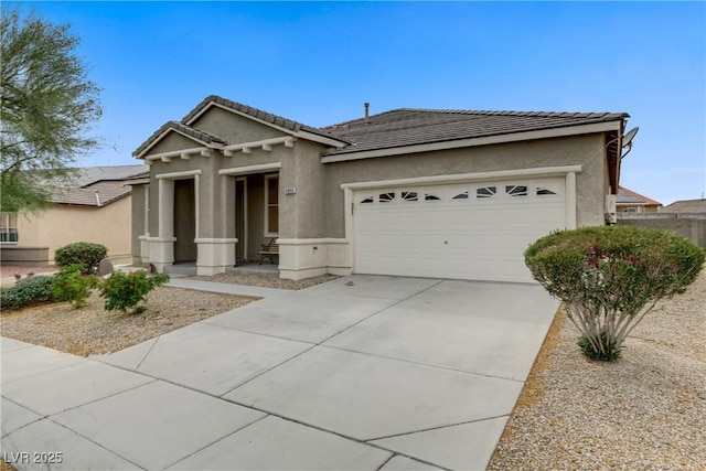 single story home with a garage, driveway, stucco siding, and a tile roof