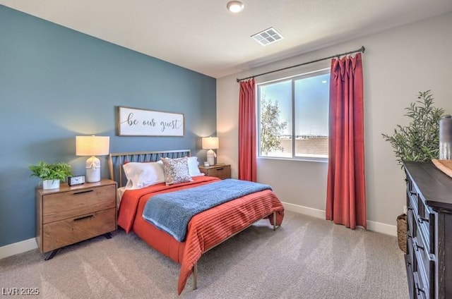 1220 Eva Creek Dr Unit 35, North Las Vegas, NV 89084 - bedroom featuring light carpet and baseboards