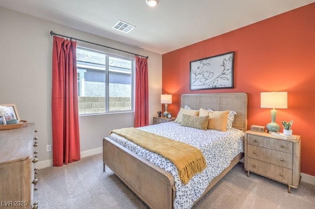 1220 Eva Creek Dr Unit 35, North Las Vegas, NV 89084 - bedroom featuring light carpet and baseboards