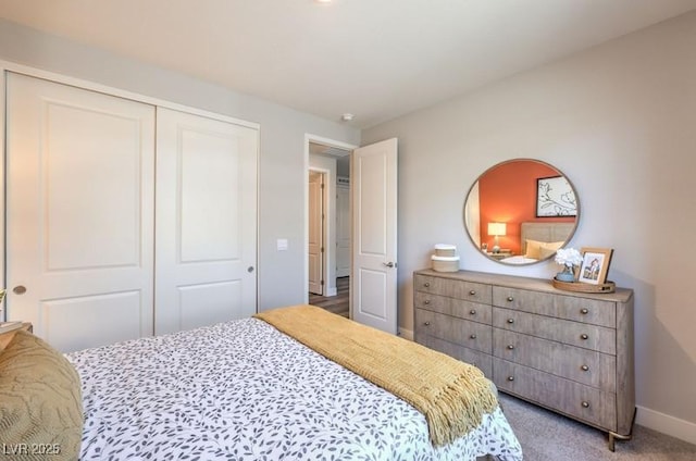 1220 Eva Creek Dr Unit 35, North Las Vegas, NV 89084 - bedroom with baseboards, a closet, and carpet flooring