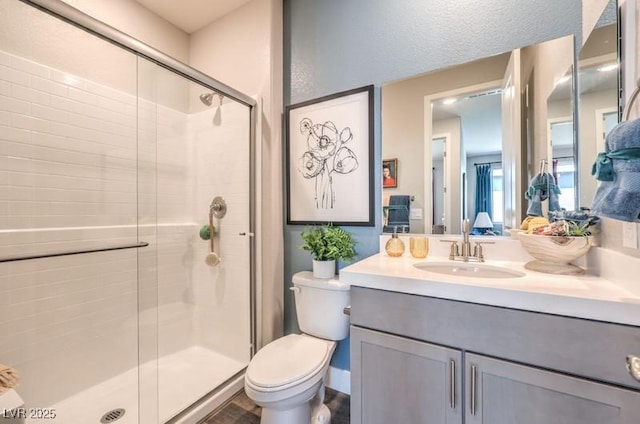 1220 Eva Creek Dr Unit 35, North Las Vegas, NV 89084 - full bath featuring a stall shower, vanity, and toilet