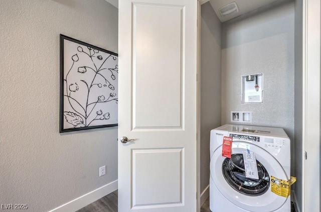 1220 Eva Creek Dr Unit 35, North Las Vegas, NV 89084 - laundry area featuring washer / clothes dryer, wood finished floors, baseboards, and a textured wall