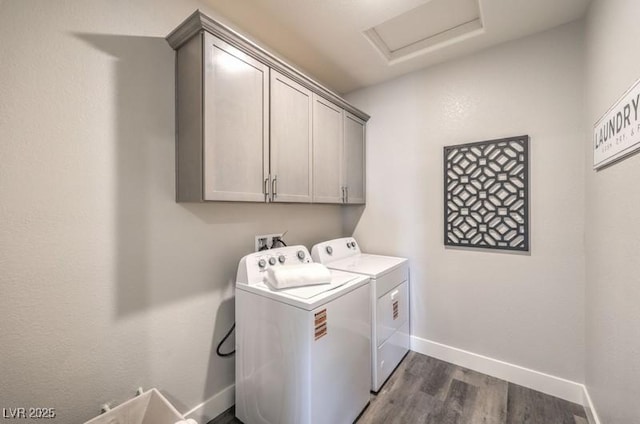 1220 Eva Creek Dr Unit 35, North Las Vegas, NV 89084 - clothes washing area with washer and clothes dryer, cabinet space, dark wood-style floors, attic access, and baseboards