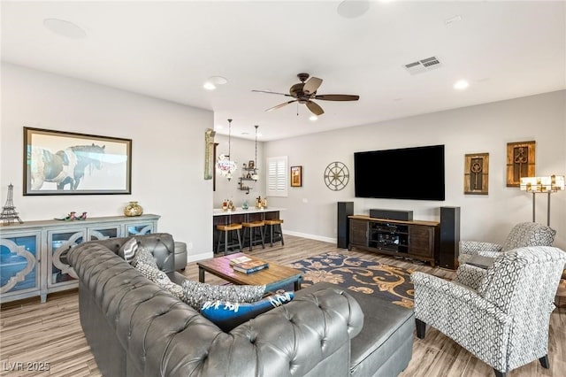 352 Dandelion Brook Ct, Las Vegas, NV 89148 - living room with light wood-style flooring, ceiling fan, recessed lighting, and baseboards