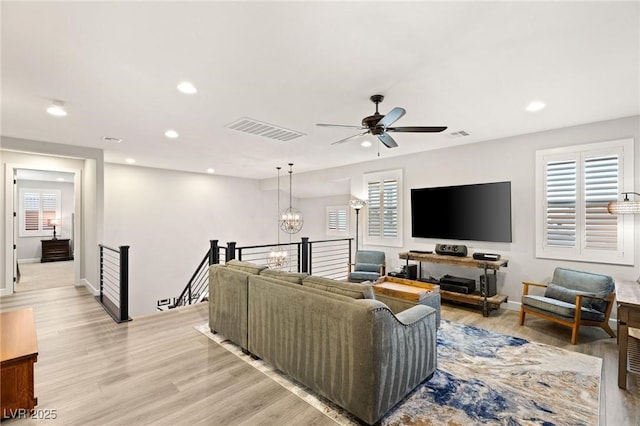 352 Dandelion Brook Ct, Las Vegas, NV 89148 - living area featuring recessed lighting, healthy amount of natural light, light wood-style floors, a ceiling fan, and a chandelier
