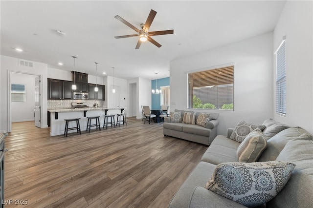 485 Pebble Run Ave, Henderson, NV 89011 - living area with light wood-style flooring, ceiling fan, and recessed lighting