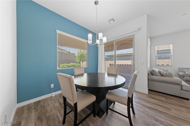 485 Pebble Run Ave, Henderson, NV 89011 - dining space featuring a chandelier, plenty of natural light, wood finished floors, and baseboards