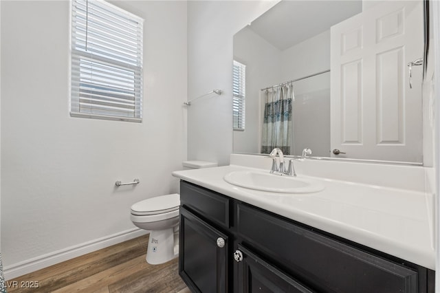 485 Pebble Run Ave, Henderson, NV 89011 - full bathroom featuring toilet, baseboards, wood finished floors, vanity, and a shower with shower curtain