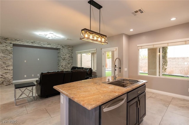 kitchen with a sink, dishwasher, light tile patterned flooring, hanging light fixtures, and open floor plan