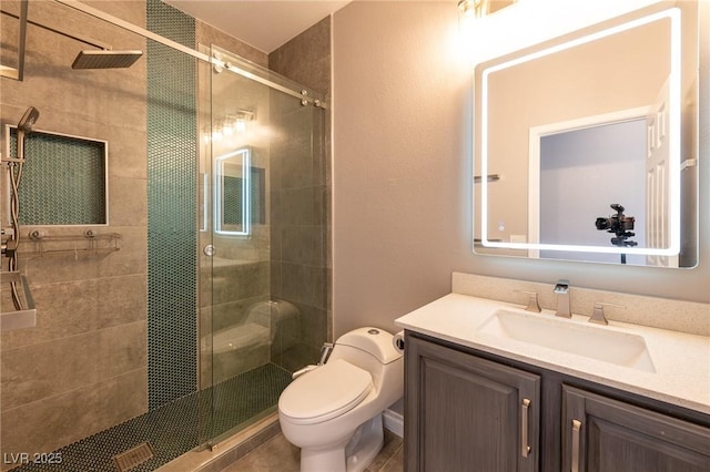 full bathroom featuring a stall shower, toilet, and vanity