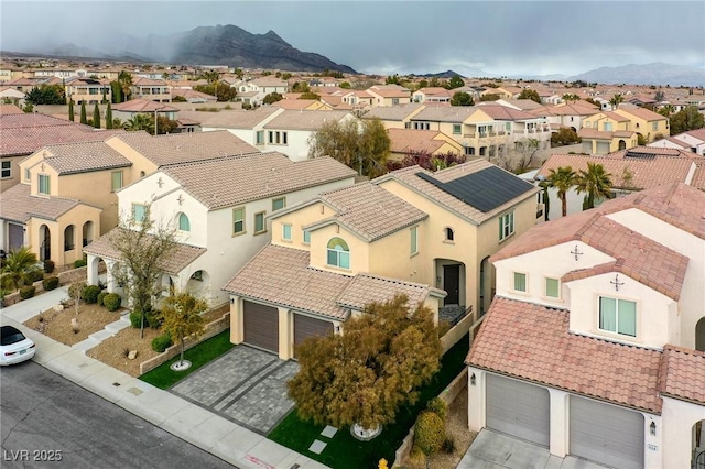aerial view of residential area with mountains
