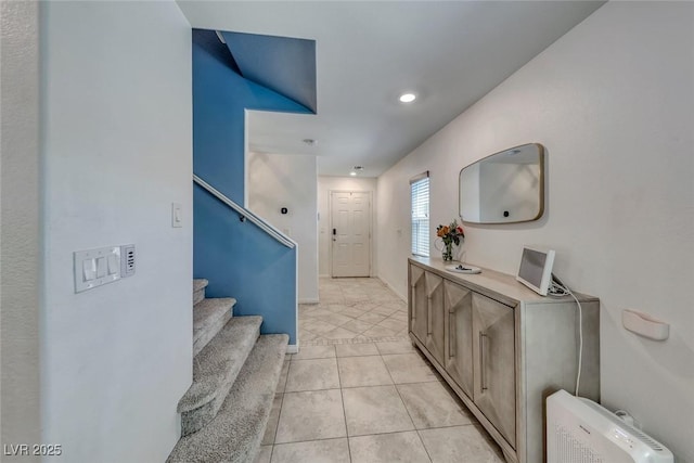 hall featuring stairs, light tile patterned floors, recessed lighting, and baseboards