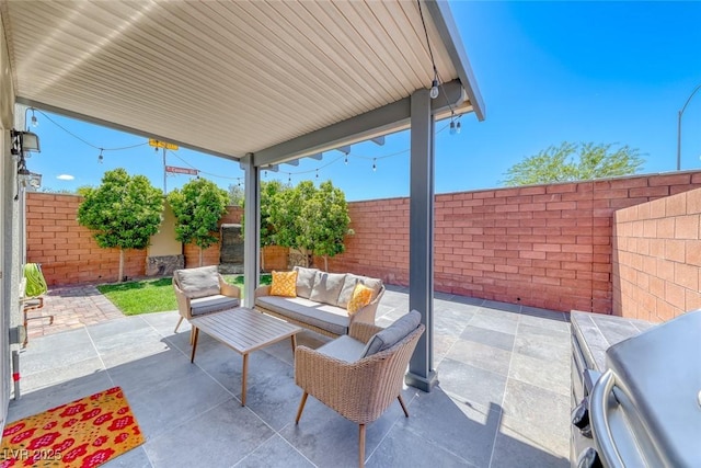 view of patio featuring a fenced backyard and outdoor lounge area