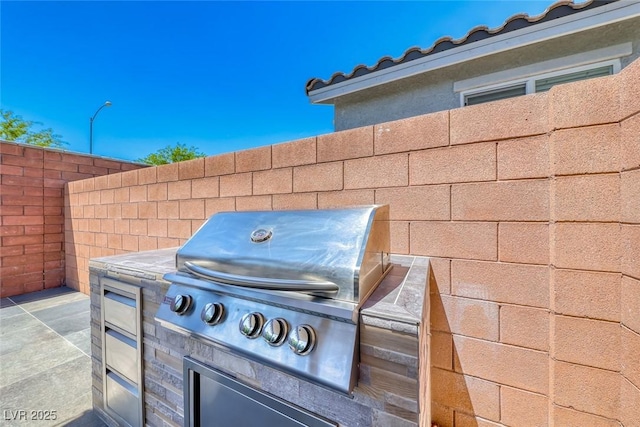 view of patio with a grill and area for grilling