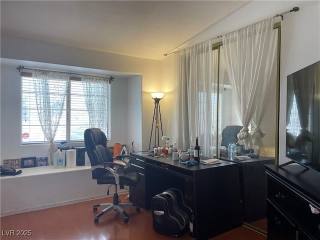 office space with wood finished floors and vaulted ceiling