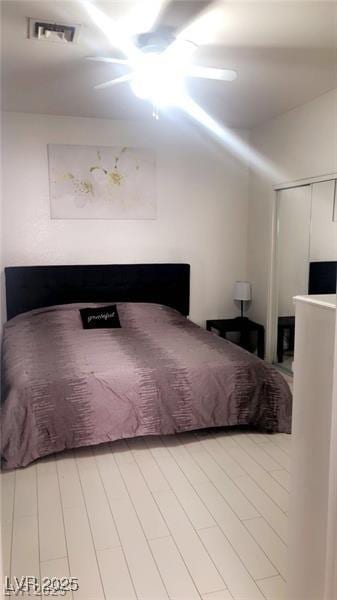 3301 W Colton Ave, North Las Vegas, NV 89032 - bedroom with ceiling fan, light wood finished floors, and a closet