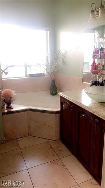 3301 W Colton Ave, North Las Vegas, NV 89032 - full bath featuring vanity, tile patterned flooring, and a garden tub