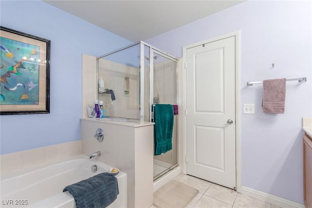 11739 Village Arbor St, Las Vegas, NV 89183 - bathroom with tile patterned floors, vanity, a shower stall, a bath, and baseboards